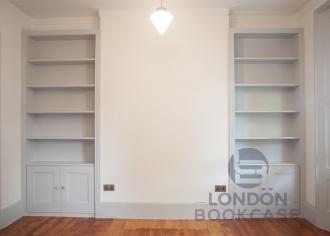 Two fitted white bookcases front view