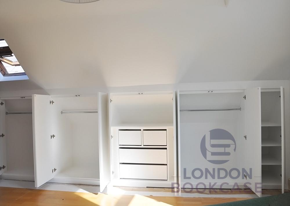 loft built-in cupboard system with push to open doors and drawers
