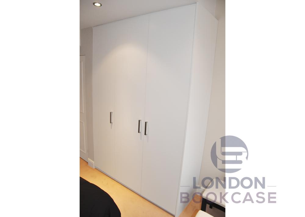white fitted wardrobe with handles
